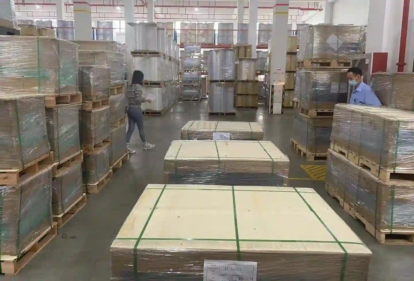 Stacked PE, PET, and BOPP metallized film rolls in Tradsark warehouse by trusted manufacturers and suppliers