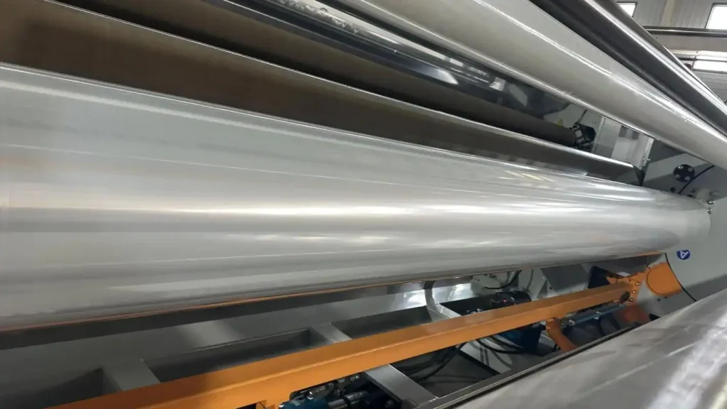 Metallized PET Film (Aluminized Polyester Film) production line showing high-barrier aluminum coating on PET base film at Tradsark New Materials factory