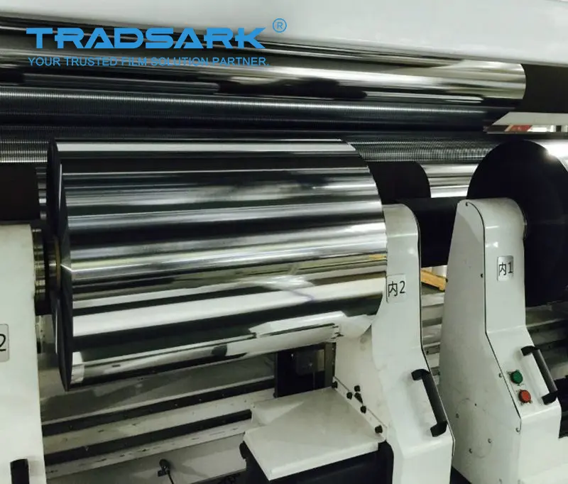 Structure of TRADSARK aluminized polyester film (Met PET) showing the vacuum metallization layer on PET substrate.